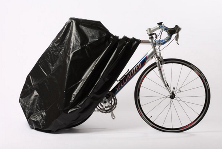 A bike partially covered by a Zerust bike cover.